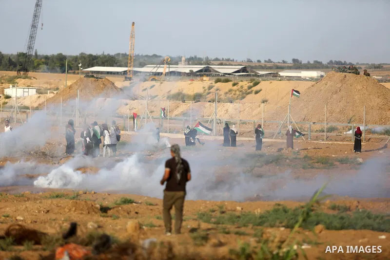 Protesters gather during a protest by Palestinian women where Palestinians demand the right to return to their homeland along the border with Israel east of Gaza City on July 3, 2018. Photo by Ashraf Amra