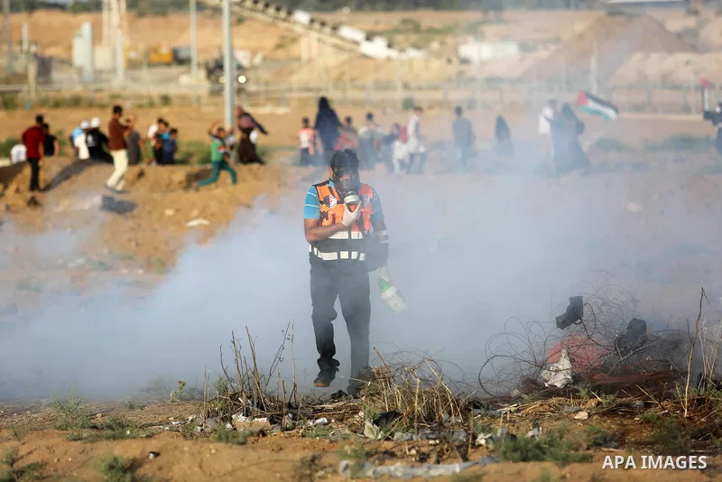 Protesters gather during a protest by Palestinian women where Palestinians demand the right to return to their homeland along the border with Israel east of Gaza City on July 3, 2018. Photo by Ashraf Amra
