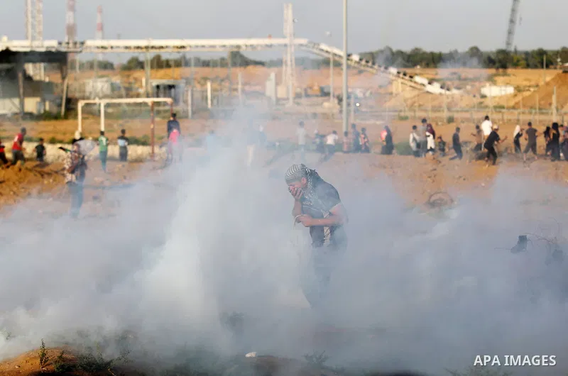 Protesters gather during a protest by Palestinian women where Palestinians demand the right to return to their homeland along the border with Israel east of Gaza City on July 3, 2018. Photo by Ashraf Amra