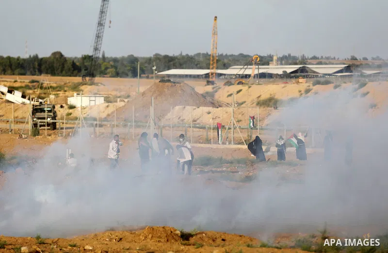 Protesters gather during a protest by Palestinian women where Palestinians demand the right to return to their homeland along the border with Israel east of Gaza City on July 3, 2018. Photo by Ashraf Amra