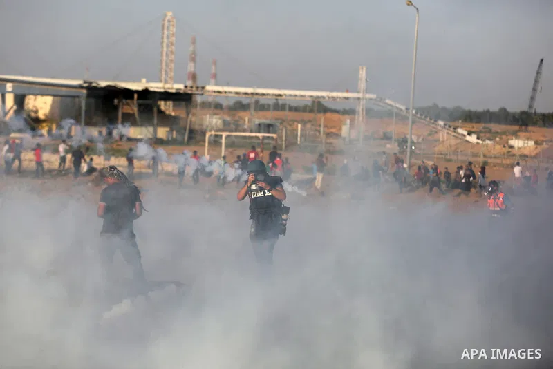 Protesters gather during a protest by Palestinian women where Palestinians demand the right to return to their homeland along the border with Israel east of Gaza City on July 3, 2018. Photo by Ashraf Amra