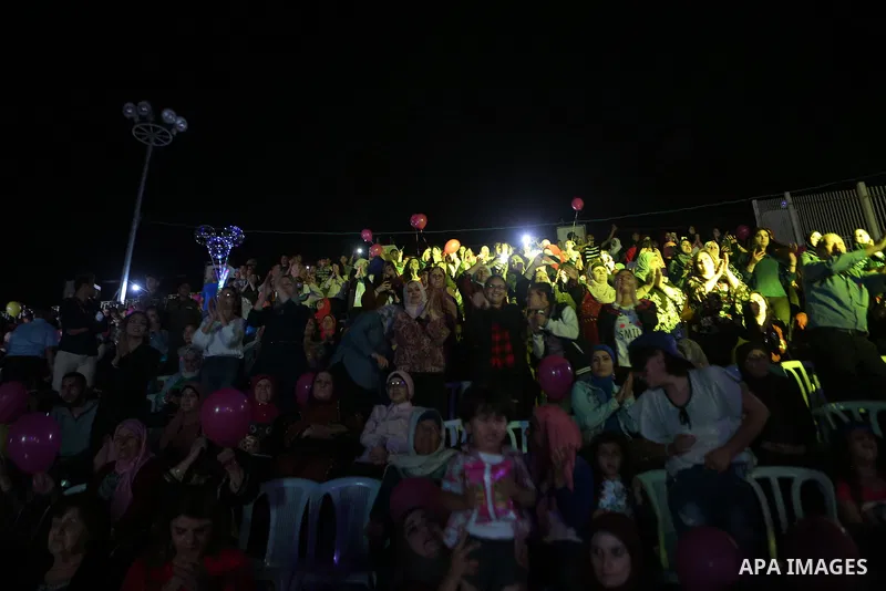 Palestinians attend a concert by Jordanian singer Hussein Salman at al-Bireh Festival, in the West Bank city Bireh, on July 3, 2018. Photo by Shadi Hatem