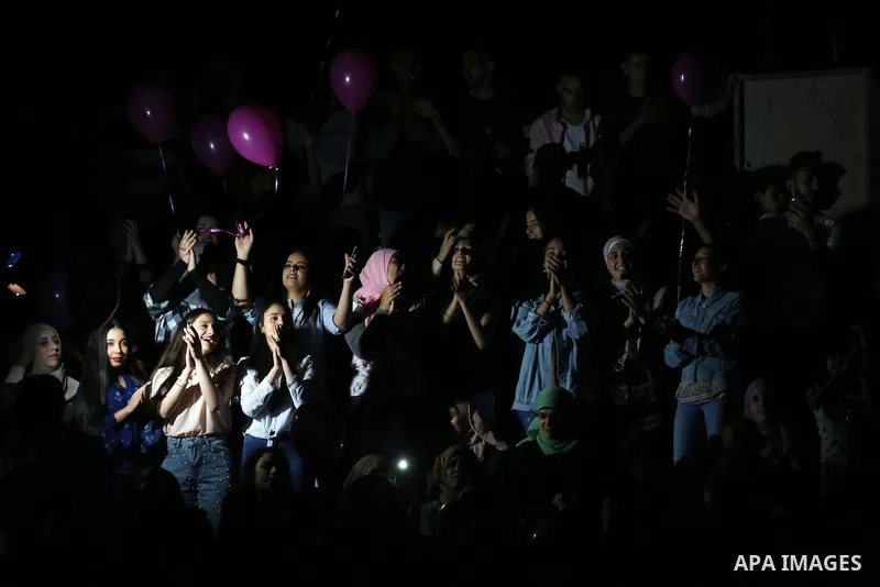 Palestinians attend a concert by Jordanian singer Hussein Salman at al-Bireh Festival, in the West Bank city Bireh, on July 3, 2018. Photo by Shadi Hatem