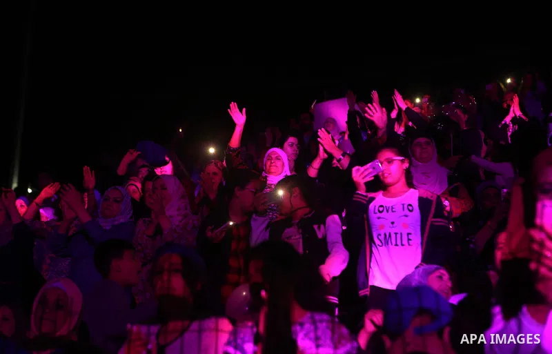 Palestinians attend a concert by Jordanian singer Hussein Salman at al-Bireh Festival, in the West Bank city Bireh, on July 3, 2018. Photo by Shadi Hatem