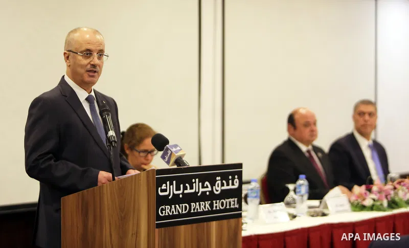 Palestinian Prime Minister, Rami Hamdallah, speaks during the launch of the report of the national team to assess the risks of the crimes of money laundering and terrorist financing, in the West bank city of Ramallah, on...