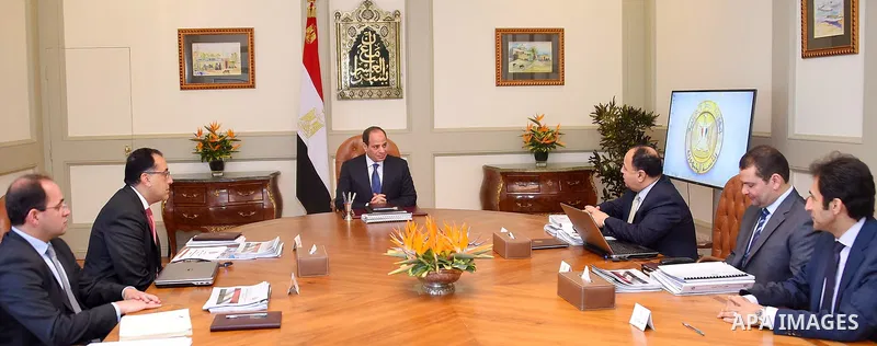 Egyptian President Abdel Fattah al-Sisi meets with Mustafa Madbouli, Prime Minister in Cairo, Egypt on July 4, 2018. Photo by Egyptian President Office
