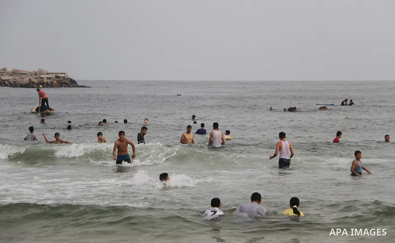 Palestinians enjoy their time at the sea coast of Gaza City, July 06, 2018. Photo by Mahmoud Ajour
