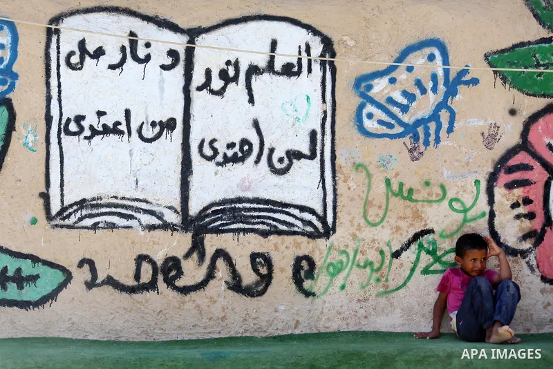 A Palestinian boy plays at the Palestinian Bedouin village of Khan al-Ahmar, east of Jerusalem in the occupied West Bank on July 6, 2018. Israel's Supreme Court has temporarily blocked the demolition of a Palestinian Bed...