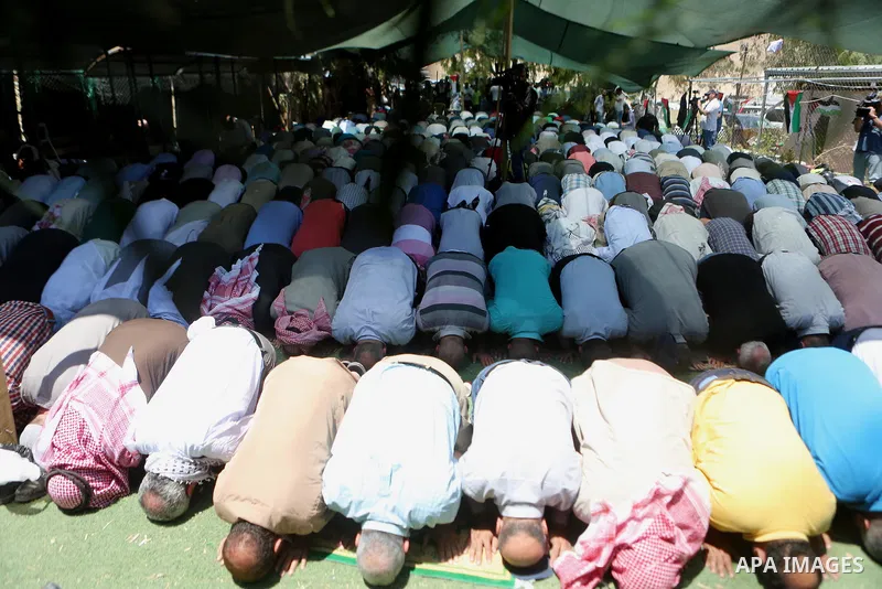 Palestinians perform Friday prayers before a demonstration against Israel at the Palestinian Bedouin village of Khan al-Ahmar, east of Jerusalem in the occupied West Bank on July 6, 2018. Israel's Supreme Court has tempo...