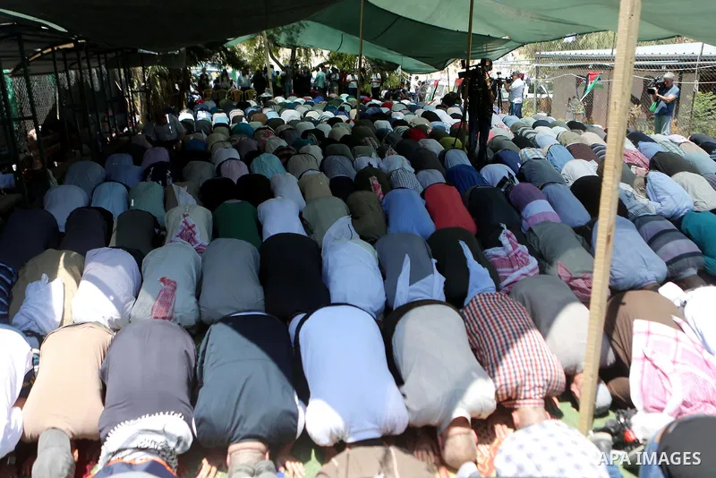 Palestinians perform Friday prayers before a demonstration against Israel at the Palestinian Bedouin village of Khan al-Ahmar, east of Jerusalem in the occupied West Bank on July 6, 2018. Israel's Supreme Court has tempo...