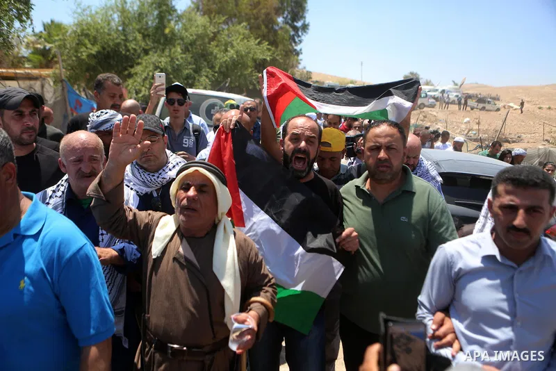 Palestinian protesters take part during a protest against Israel at the Palestinian Bedouin village of Khan al-Ahmar, east of Jerusalem in the occupied West Bank on July 6, 2018. Israel's Supreme Court has temporarily bl...