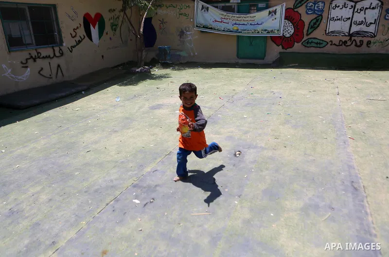 A Palestinian boy plays at the Palestinian Bedouin village of Khan al-Ahmar, east of Jerusalem in the occupied West Bank on July 6, 2018. Israel's Supreme Court has temporarily blocked the demolition of a Palestinian Bed...