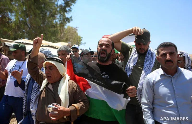 Palestinian protesters take part during a protest against Israel at the Palestinian Bedouin village of Khan al-Ahmar, east of Jerusalem in the occupied West Bank on July 6, 2018. Israel's Supreme Court has temporarily bl...