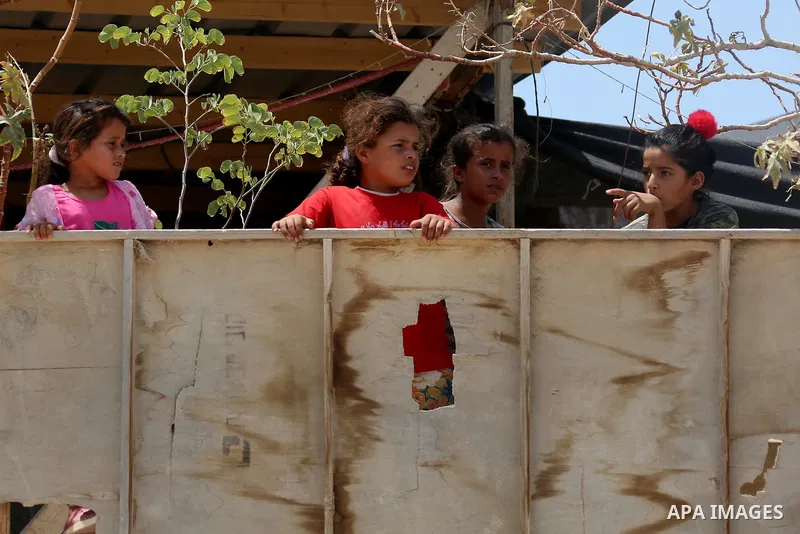 Palestinian children play at the Palestinian Bedouin village of Khan al-Ahmar, east of Jerusalem in the occupied West Bank on July 6, 2018. Israel's Supreme Court has temporarily blocked the demolition of a Palestinian B...