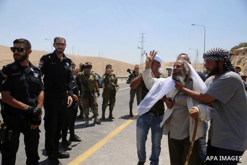 Palestinian protesters take part during a protest against Israel at the Palestinian Bedouin village of Khan al-Ahmar, east of Jerusalem in the occupied West Bank on July 6, 2018. Israel's Supreme Court has temporarily bl...