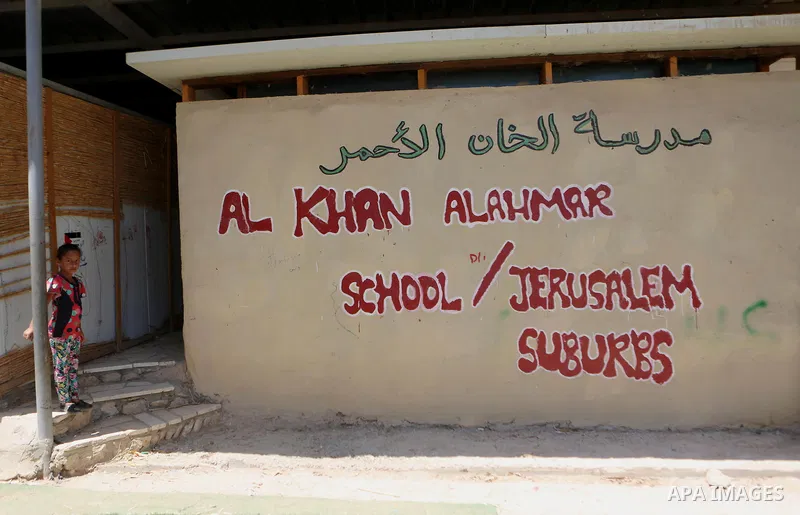 A Palestinian girl stands outside Khan al-Ahmar's school at the Palestinian Bedouin village of Khan al-Ahmar, east of Jerusalem in the occupied West Bank on July 6, 2018. Israel's Supreme Court has temporarily blocked th...