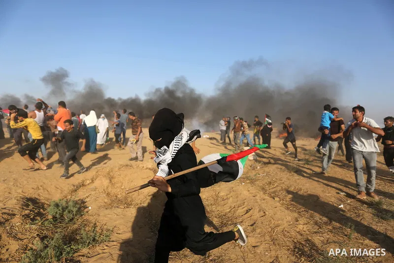 Palestinian protesters gather during clashes with Israeli troops in tents protest where Palestinian demand the right to return to their homeland at the Israel-Gaza border, in Khan Younis in the southern Gaza Strip on Jul...
