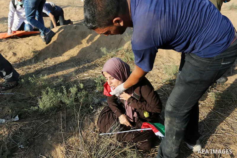 Palestinian protesters gather during clashes with Israeli troops in tents protest where Palestinian demand the right to return to their homeland at the Israel-Gaza border, in Khan Younis in the southern Gaza Strip on Jul...