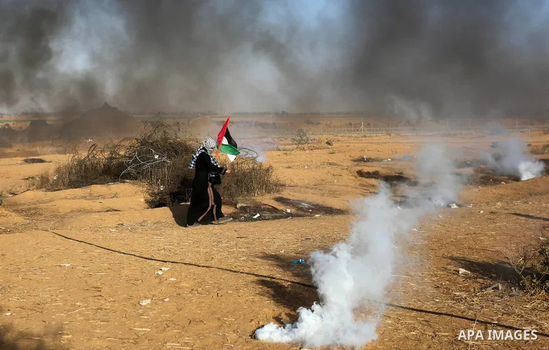 Palestinian protesters gather during clashes with Israeli troops in tents protest where Palestinian demand the right to return to their homeland at the Israel-Gaza border, in Khan Younis in the southern Gaza Strip on Jul...