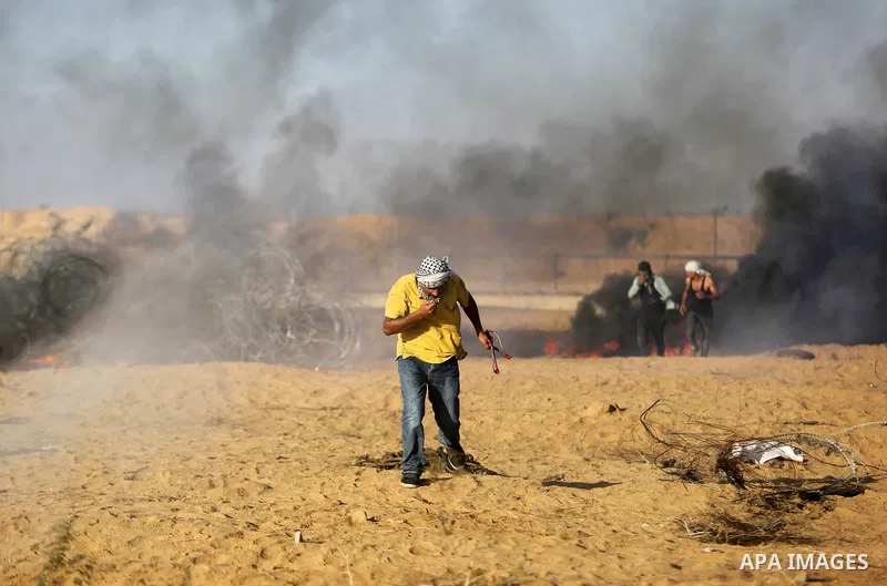 Palestinian protesters gather during clashes with Israeli troops in tents protest where Palestinian demand the right to return to their homeland at the Israel-Gaza border, in Khan Younis in the southern Gaza Strip on Jul...