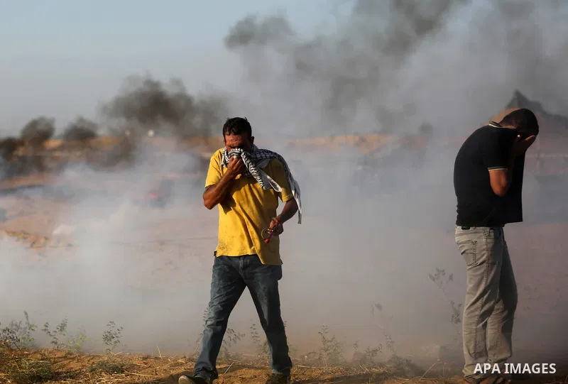 Palestinian protesters gather during clashes with Israeli troops in tents protest where Palestinian demand the right to return to their homeland at the Israel-Gaza border, in Khan Younis in the southern Gaza Strip on Jul...