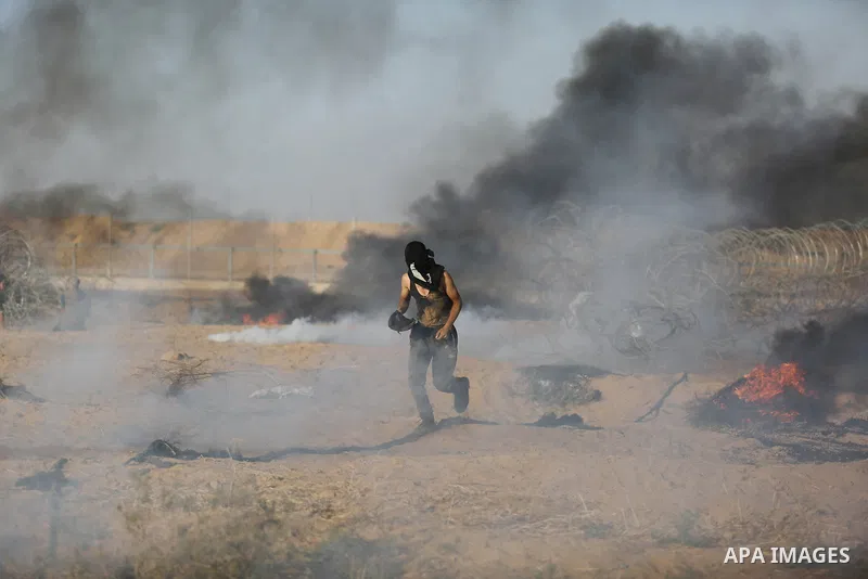 Palestinian protesters gather during clashes with Israeli troops in tents protest where Palestinian demand the right to return to their homeland at the Israel-Gaza border, in Khan Younis in the southern Gaza Strip on Jul...