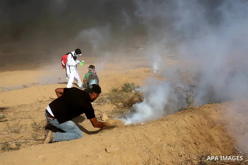 Palestinian protesters gather during clashes with Israeli troops in tents protest where Palestinian demand the right to return to their homeland at the Israel-Gaza border, in Khan Younis in the southern Gaza Strip on Jul...