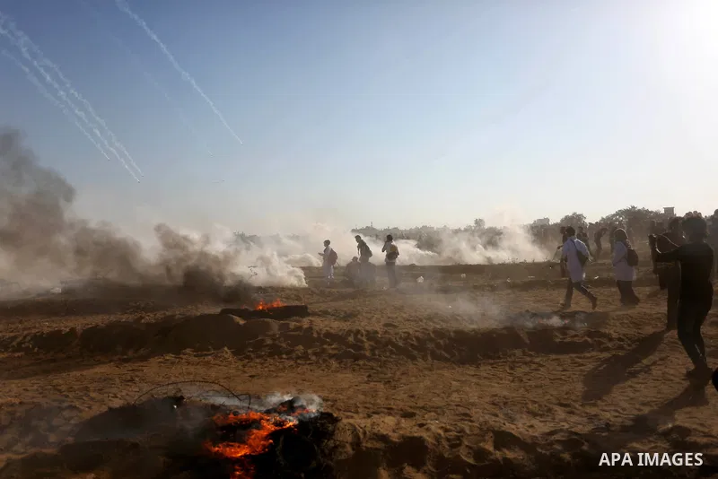 Palestinian protesters gather during clashes with Israeli troops in tents protest where Palestinian demand the right to return to their homeland at the Israel-Gaza border, in Khan Younis in the southern Gaza Strip on Jul...