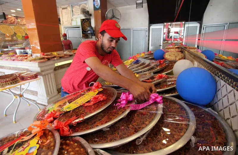 A Palestinian vendor displays sweets ahead the results of high school exams, known as ''Tawjihi'', in Gaza city, on July 8, 2018. Photo by Mahmoud Ajour