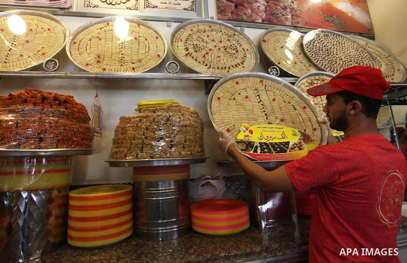 A Palestinian vendor displays sweets ahead the results of high school exams, known as ''Tawjihi'', in Gaza city, on July 8, 2018. Photo by Mahmoud Ajour