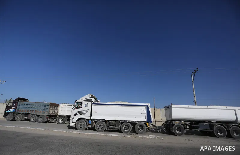 Loaded trucks cross the Kerem Shalom crossing to Rafah in southern Gaza Strip on July 9, 2018. Israel closed its only goods crossing with the Gaza Strip on Monday over weeks of fires at farms caused by kites and balloons...