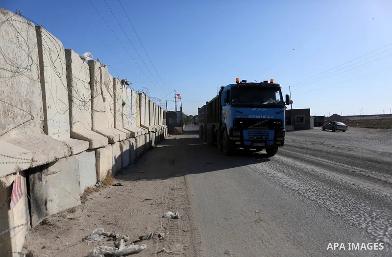 Loaded trucks cross the Kerem Shalom crossing to Rafah in southern Gaza Strip on July 9, 2018. Israel closed its only goods crossing with the Gaza Strip on Monday over weeks of fires at farms caused by kites and balloons...