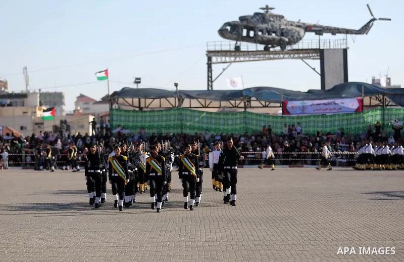 Palestinian police officers participate in their a graduation ceremony in Gaza City on July 11, 2018. Photo by Ashraf Amra