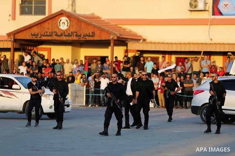 Palestinian police officers show their skills during a graduation ceremony in Gaza City on July 11, 2018. Photo by Ashraf Amra
