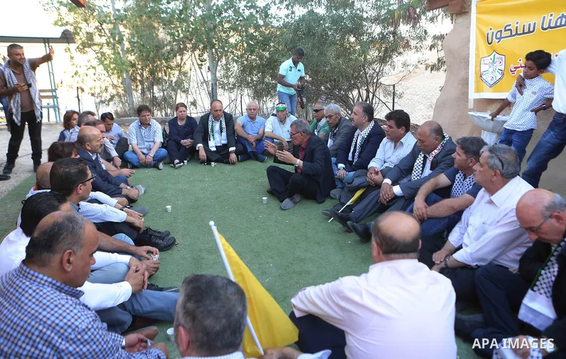 Palestinians take part in a meeting of Fatah Revolutionary Council at the Palestinian Bedouin village of Khan al-Ahmar, east of Jerusalem in the occupied West Bank on July 12, 2018. Photo by Shadi Hatem