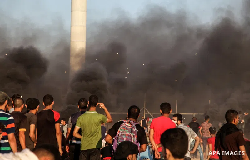 Palestinian protesters gather during clashes with Israeli troops in tents protest where Palestinian demand the right to return to their homeland at the Israel-Gaza border, in Rafah in the southern Gaza Strip on July 13,...
