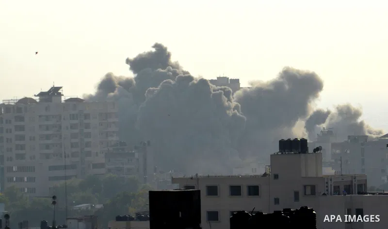 Smoke raises above buildings during an Israeli air strike on Gaza City on July 14, 2018. Israel's military renewed air strikes targeting Hamas in the Gaza Strip today, following border clashes in which two Palestinians i...