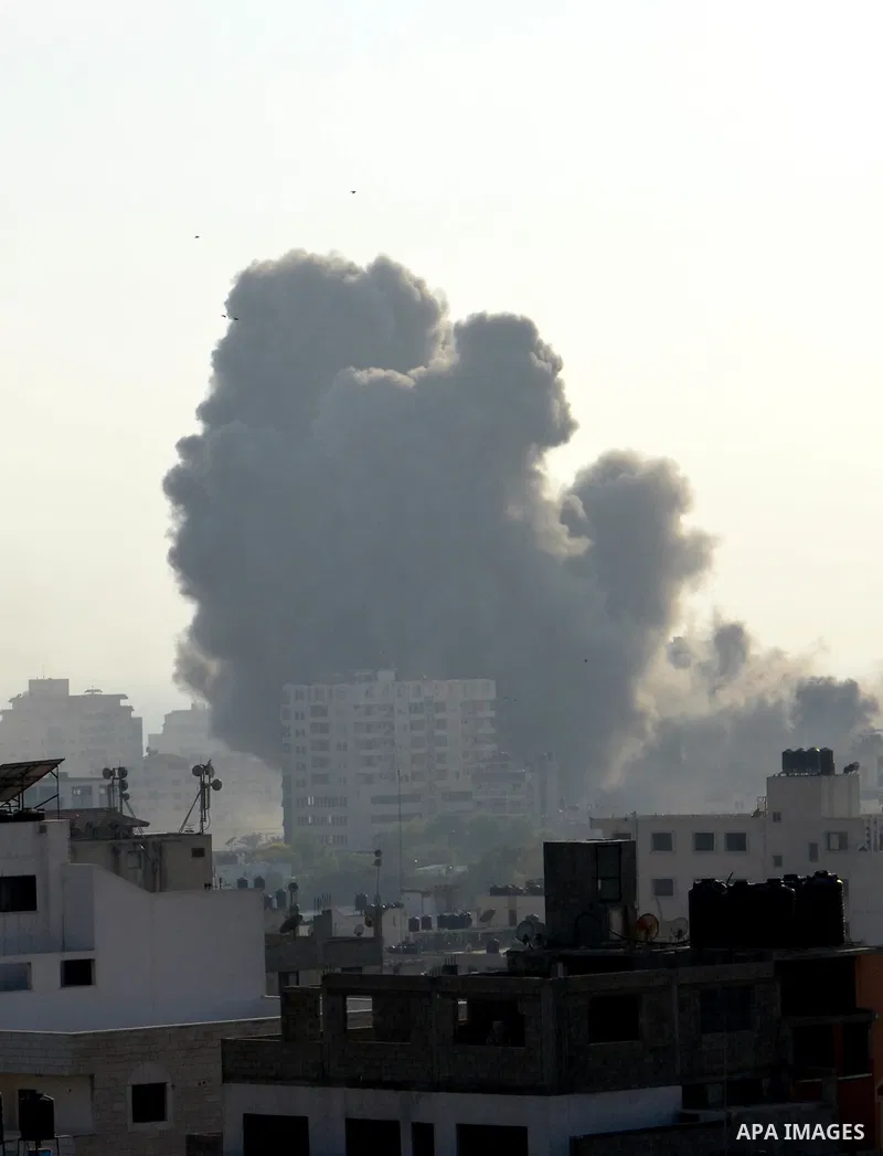 Smoke raises above buildings during an Israeli air strike on Gaza City on July 14, 2018. Israel's military renewed air strikes targeting Hamas in the Gaza Strip today, following border clashes in which two Palestinians i...