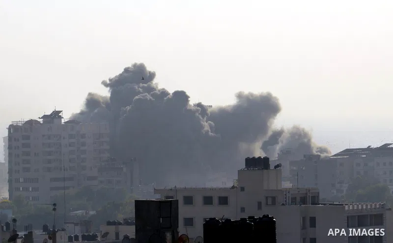 Smoke raises above buildings during an Israeli air strike on Gaza City on July 14, 2018. Israel's military renewed air strikes targeting Hamas in the Gaza Strip today, following border clashes in which two Palestinians i...