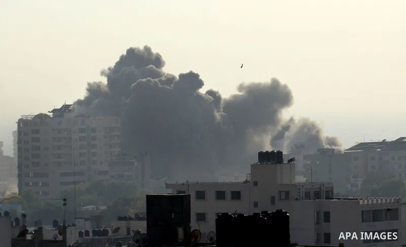 Smoke raises above buildings during an Israeli air strike on Gaza City on July 14, 2018. Israel's military renewed air strikes targeting Hamas in the Gaza Strip today, following border clashes in which two Palestinians i...