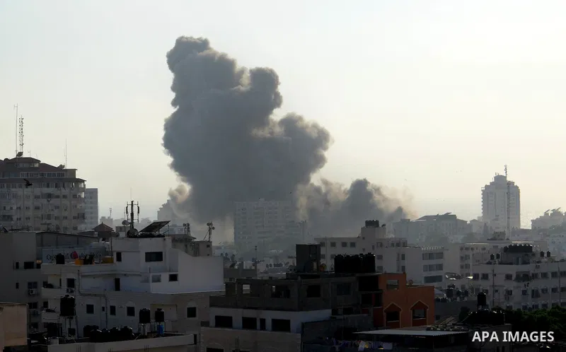 Smoke raises above buildings during an Israeli air strike on Gaza City on July 14, 2018. Israel's military renewed air strikes targeting Hamas in the Gaza Strip today, following border clashes in which two Palestinians i...