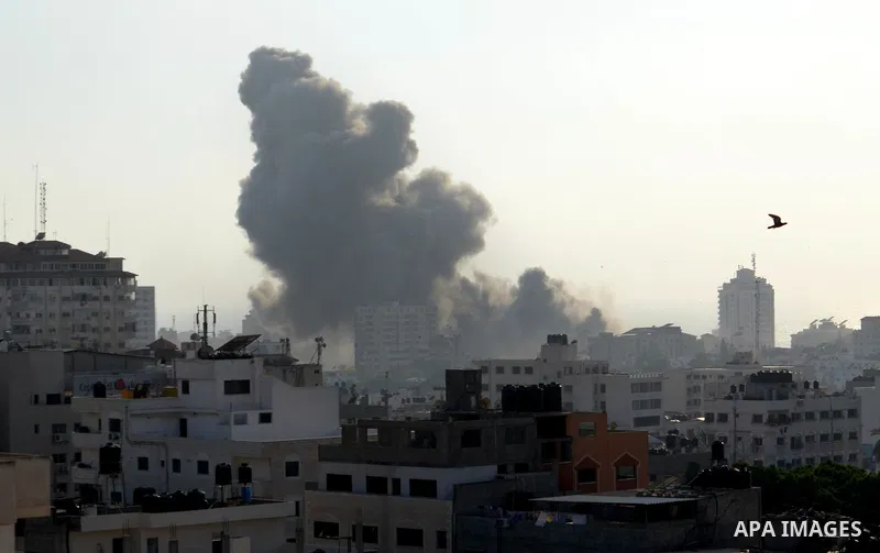 Smoke raises above buildings during an Israeli air strike on Gaza City on July 14, 2018. Israel's military renewed air strikes targeting Hamas in the Gaza Strip today, following border clashes in which two Palestinians i...