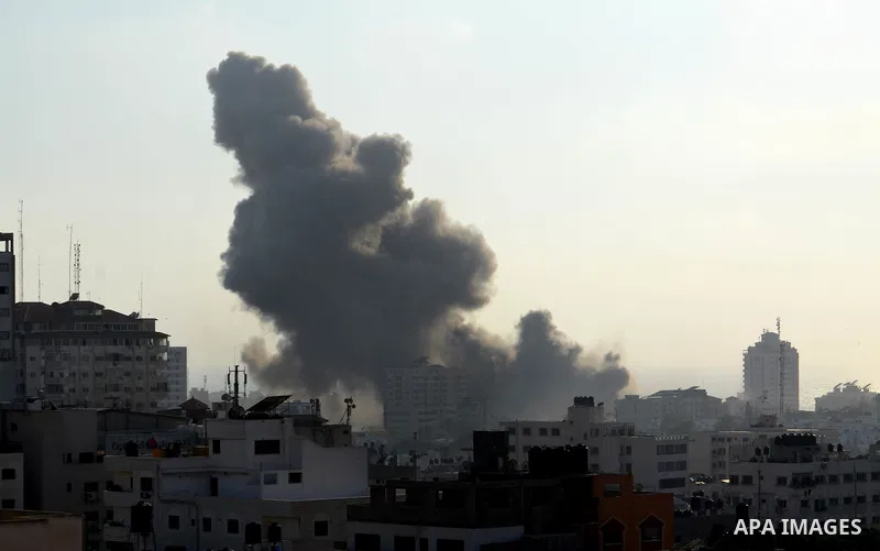 Smoke raises above buildings during an Israeli air strike on Gaza City on July 14, 2018. Israel's military renewed air strikes targeting Hamas in the Gaza Strip today, following border clashes in which two Palestinians i...