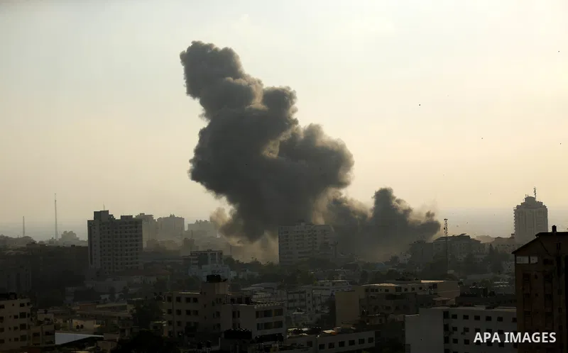 Smoke raises above buildings during an Israeli air strike on Gaza City on July 14, 2018. Israel's military renewed air strikes targeting Hamas in the Gaza Strip today, following border clashes in which two Palestinians i...
