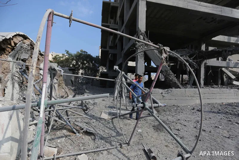 Palestinians inspect the building that was damaged in an Israeli airstrike on the Gaza City, on July 15, 2018. Israel's military said it had launched air strikes targeting Hamas in the Gaza Strip on July 14, as rockets a...