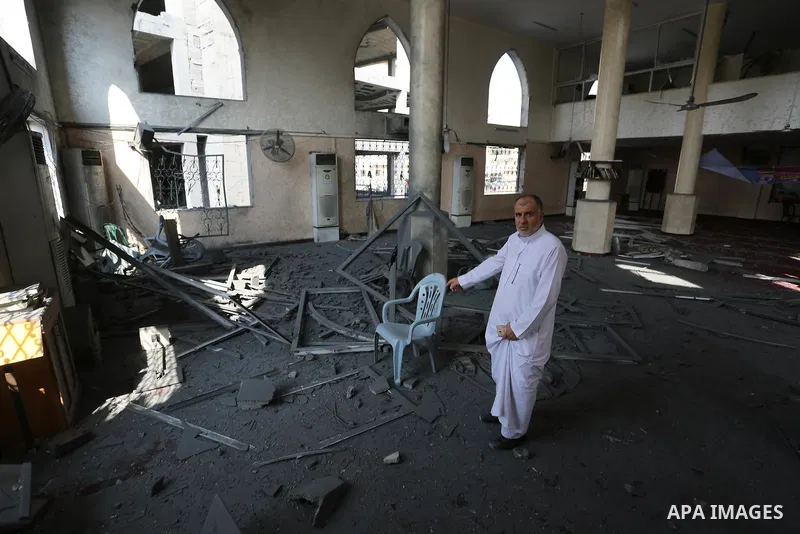 Palestinians inspect a mosque that was damaged in an Israeli airstrike on the Gaza City, on July 15, 2018. Israel's military said it had launched air strikes targeting Hamas in the Gaza Strip on July 14, as rockets and m...