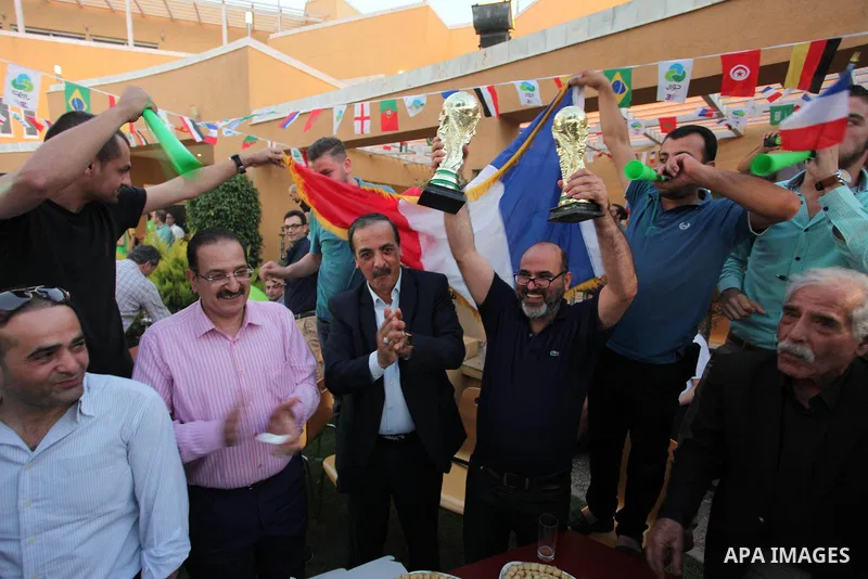 Palestinians celebrate after the 2018 FIFA World Cup final match between France and Croatia at the French Cultural Center in Gaza city, on July 15, 2018. France defeated Croatia 4-2 and claimed the title. Photo by Mahmou...