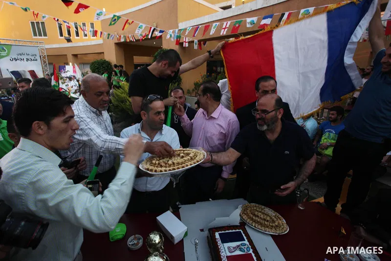 Palestinians celebrate after the 2018 FIFA World Cup final match between France and Croatia at the French Cultural Center in Gaza city, on July 15, 2018. France defeated Croatia 4-2 and claimed the title. Photo by Mahmou...