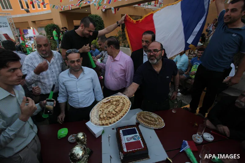 Palestinians celebrate after the 2018 FIFA World Cup final match between France and Croatia at the French Cultural Center in Gaza city, on July 15, 2018. France defeated Croatia 4-2 and claimed the title. Photo by Mahmou...