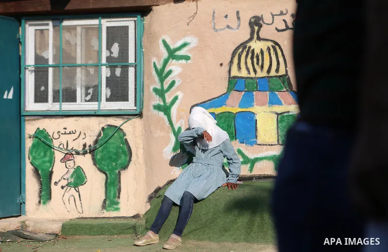 Palestinian schoolchildren return back to their school in the morning of the first day of the new year study, at Khan al-Ahmar's school at the Palestinian Bedouin village of Khan al-Ahmar, east of Jerusalem in the occupi...